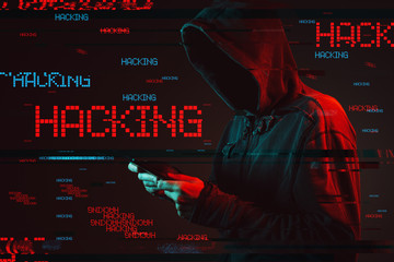 Computer hacking concept with faceless hooded male person