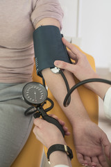 Doctor Measuring Blood Pressure
