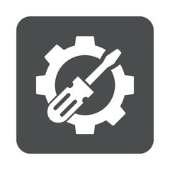 cono plano destornillador en engranaje en cuadrado gris