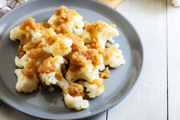 Vegetarian cooked cauliflower with bread crumb