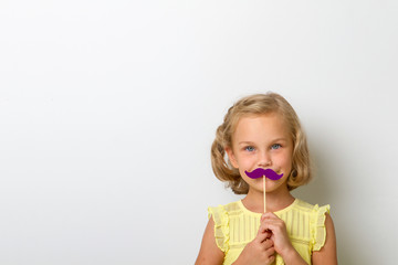 Free time for fun. Close up portrait small girl with fake mustache with plump