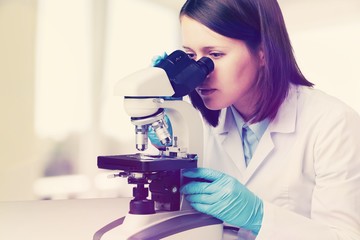 Young male scientist Working with Microscope
