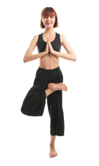 Sporty woman practicing yoga on white background