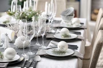 Table served for Christmas dinner in living room