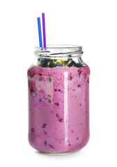 Glass jar of tasty blueberry smoothie on white background