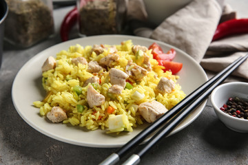 Delicious rice with meat and vegetables on plate