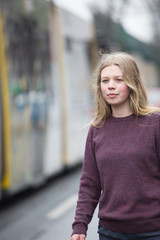 Young woman looking for taxi in the city