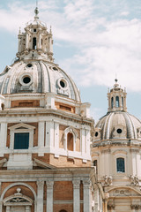 Fototapeta premium The architecture of Rome and the Italian style in stucco. Sights of the old town, tourist places. Street art, world heritage. Miracle of light. Carved columns and capitals