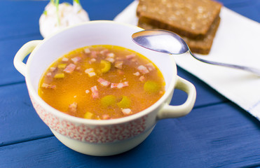 Soup of saltwort. Soup from different types of sausages, olives, potatoes, tomato paste.