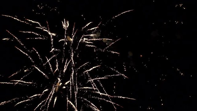 Fireworks exploding in the dark night sky during a celebration, shot with Ultra High Definition resolution.