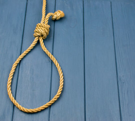 Hinge for the gallows on a wooden background.