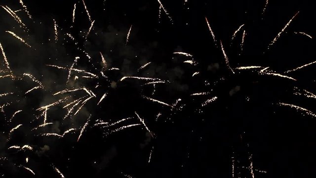 Fireworks exploding in the dark night sky during a celebration, shot with Ultra High Definition resolution.