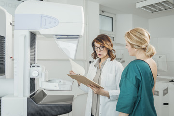 Doctor and Patient on Mammography Examination