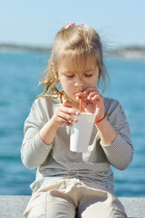 little girl drinking cocoa