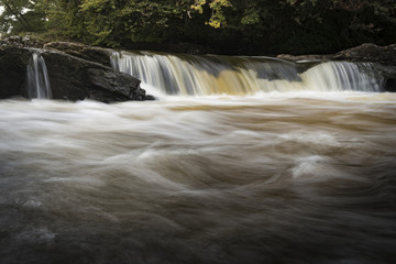 A close-up section of the Falls of Dochart in Killin in Scotland.
