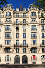 Typical architecture facade of an apartment building in Paris, France
