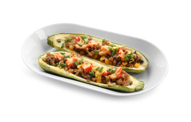 Plate with meat stuffed zucchini boats on white background