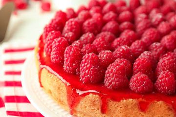 Delicious raspberry cheesecake on table, closeup