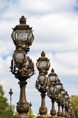 Fototapeta na wymiar Ornate lanterns at the Pont Alexandre III in Paris, France