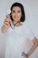 confident friendly happy smiling female doctor, woman doctor, woman surgeon, woman physician, hospital worker, health care profession studio white isolated portrait. doctor with stethoscope