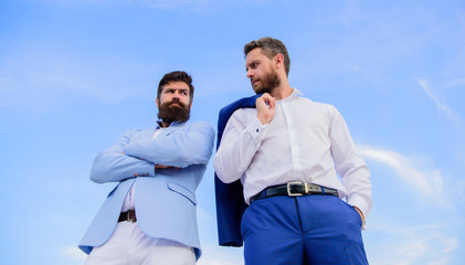 Perfect in every detail. Business men stand back to back blue sky background. Impeccable appearance improves reputation professional entrepreneur. Bearded entrepreneurs posing confidently bottom view