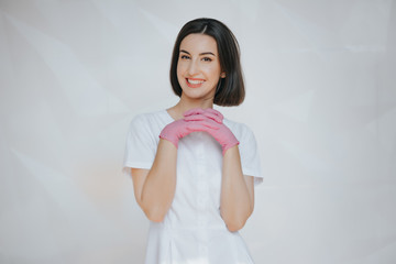 confident friendly happy smiling female doctor, woman doctor, woman surgeon, woman physician, hospital worker, health care profession studio white isolated portrait. Patient visit.