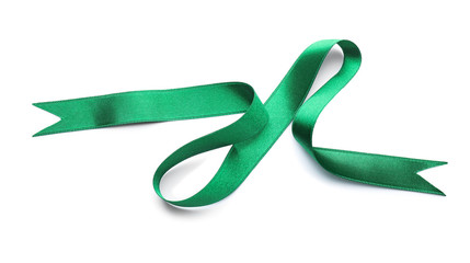 Green satin ribbon on white background