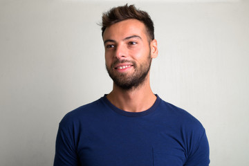 Obraz premium Studio shot of young handsome bearded man