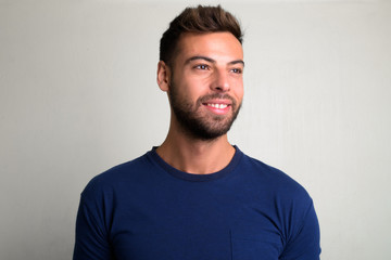 Studio shot of young handsome bearded man