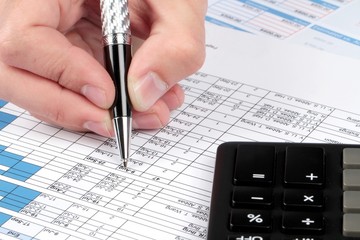 Man Analyzing Financial Reports Close-up
