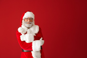 Portrait of Santa Claus on color background