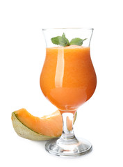 Glass of fresh melon smoothie on white background