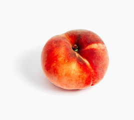 Saturn Peach isolated on white background. One flat doughnut peach.