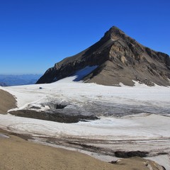 Diablerets Glacier and peak of Mount Oldenhorn in summer. Glacier 3000, Switzerland.