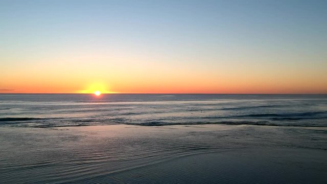 Drone footage of a spectacular sunset and surfing in Yallingup Western Australia. Watch surfers play on the waves as the sun sets into the Indian Ocean.
