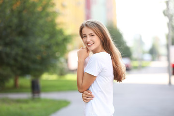 Portrait of beautiful young woman outdoors