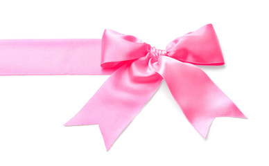 Pink ribbon with bow on white background