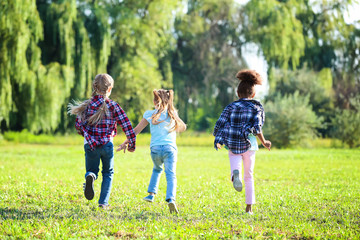 Fototapeta premium Cute little girls running outdoors