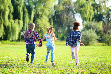 Cute little girls running outdoors