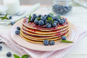 Vintage pancakes outside garden with blueberries