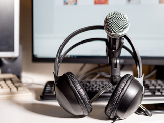 Podcast studio: microphone with headphones with computer