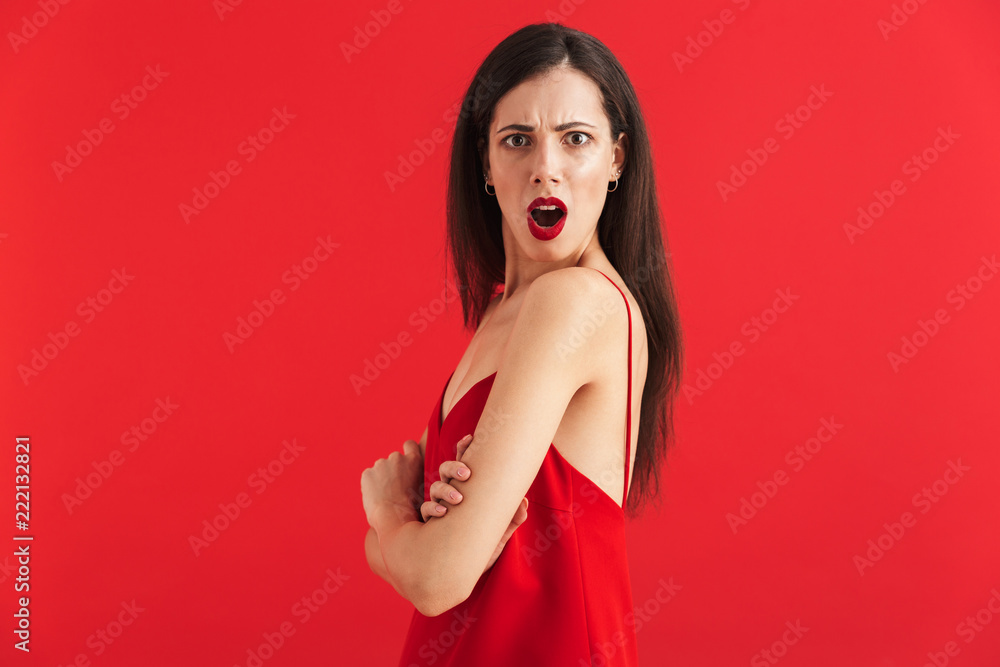 Wall mural portrait of an angry young woman in dress