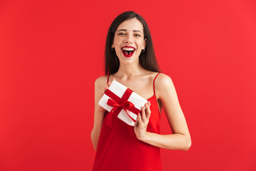Fototapeta premium Portrait of a cheerful young woman in dress