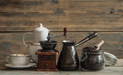 Coffee bean in glass jar on wooden table.