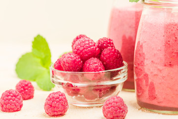 Raspberry smoothie close up photography with fresh summer blended cocktail and ripe berries.