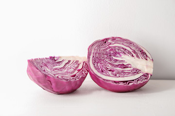 Fototapeta premium Cut red cabbage on white table