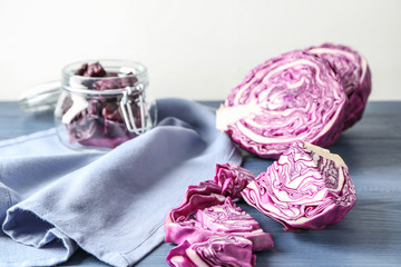 Obraz na płótnie Canvas Cut red cabbage on wooden table