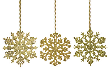 three gold snowflake shape decorations on chains
