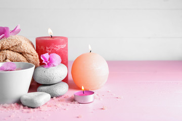Spa composition with hydrangea flowers, candles and sea salt on color table