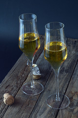two glasses of spumante wine on wooden plane